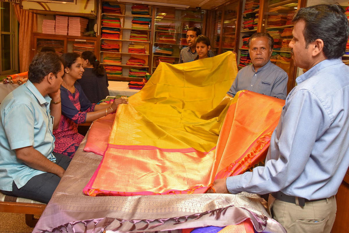 People purchasing silk Saris for Ugadi festival in Vijayalakshmi Silks and Sarees, M G Road in Bengaluru. Photo by S K Dinesh