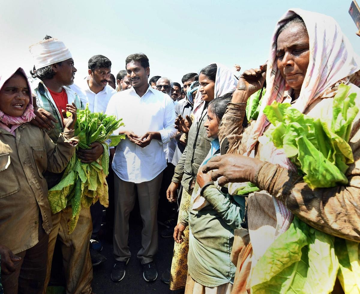 YSRCP President Jaganmohan Reddy meets farmers during his Praja Sankalpa Yatra at Polineni Palem in Nellore district on Saturday.