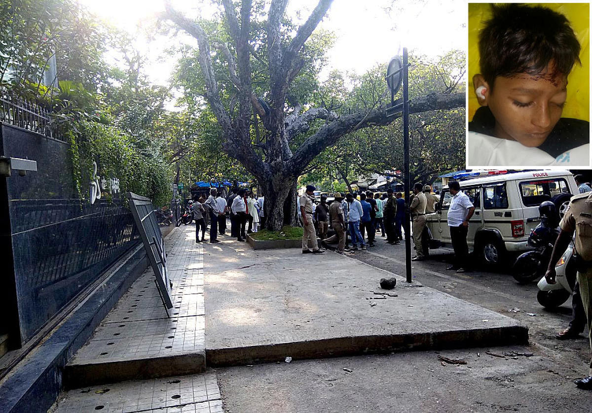 Manjunath 12 years (inset) died after a sliding gate fell on him by passing beside the gate in Bengaluru on Friday.