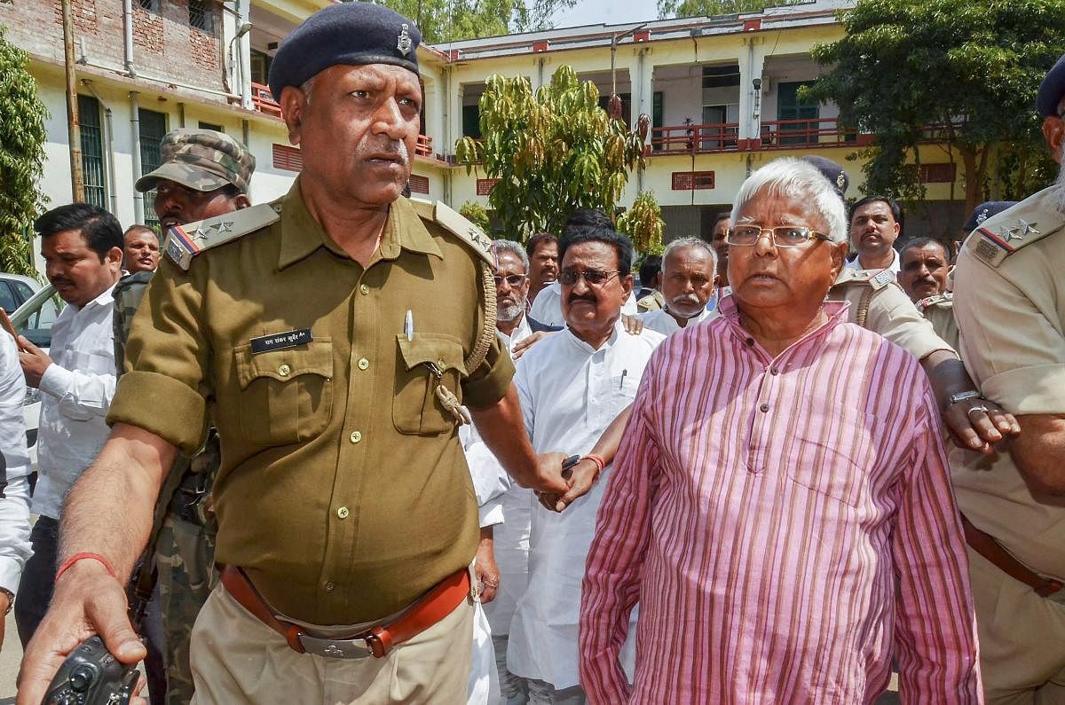 RJD chief and former Bihar Chief Minister Lalu Prasad Yadav arrives to appear before the special CBI court in connection with multi-crore fodder scam case in Ranchi. PTI file photo.