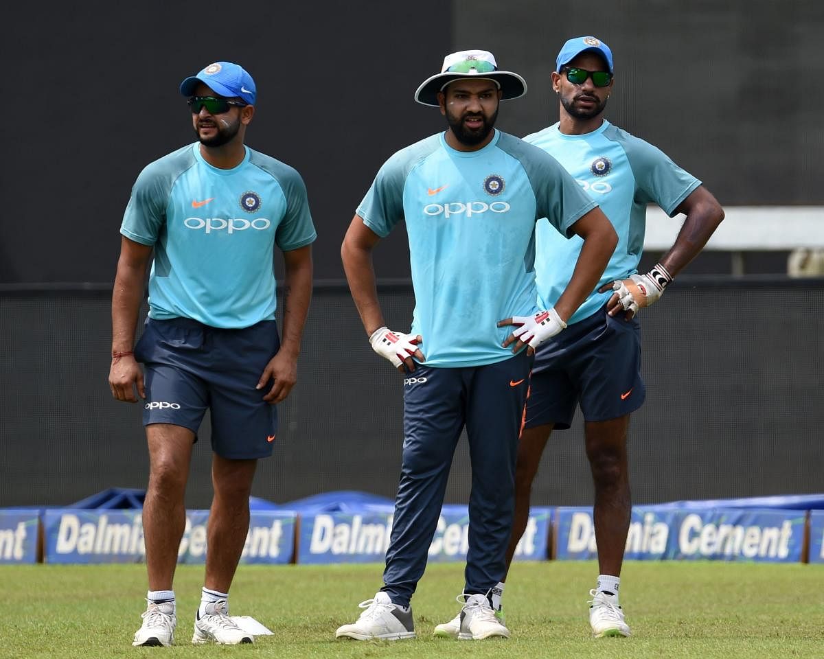 Suresh Raina, Rohit Sharma and Shikhar Dhawan (from left) will be the batting mainstays as India take on Bangladesh in the final on Sunday. AFP