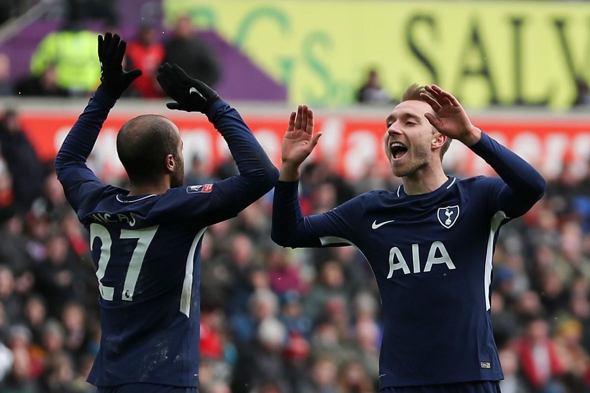 STEPPING UP: Tottenham Hotspur's Christian Eriksen (right) celebrates with Lucas Moura after scoring against Swansea City. AFP