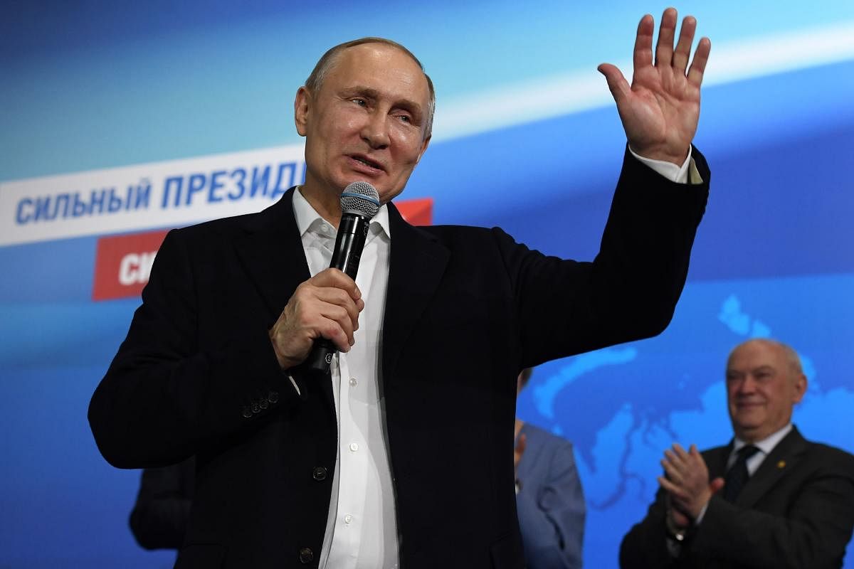 Russian President and Presidential candidate Vladimir Putin speaks during a meeting with supporters at his campaign headquarters in Moscow. Reuters file photo