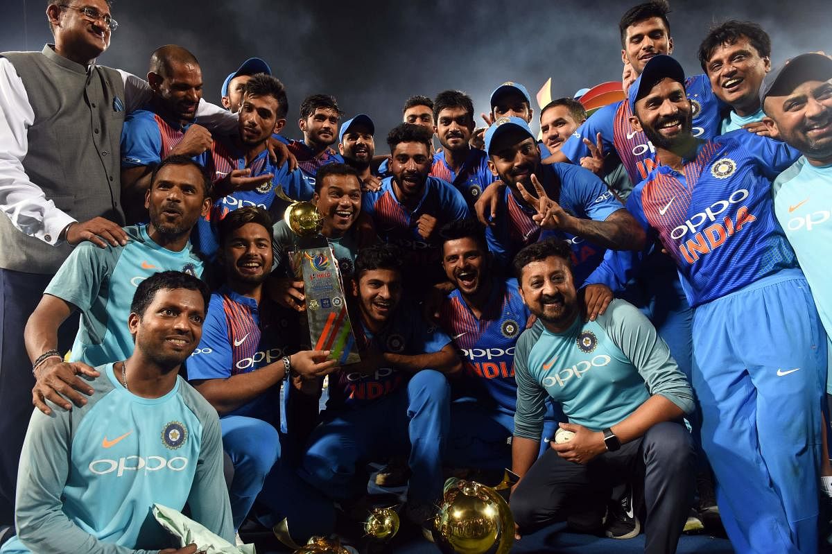 OVER THE MOON A victorious India team poses with the Nidahas Trophy after pipping Bangladesh in a pulsating final. AFP