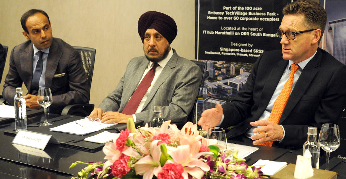 CEO of Embassy office parks Mike Holland (extreem right) addressing media as president hospitality business Embassy group Sartaj Singh (middle) and senior vice president and country head Hilton India Navjit Ahluwalia (left) looks. Photo Srikanta Sharma R.