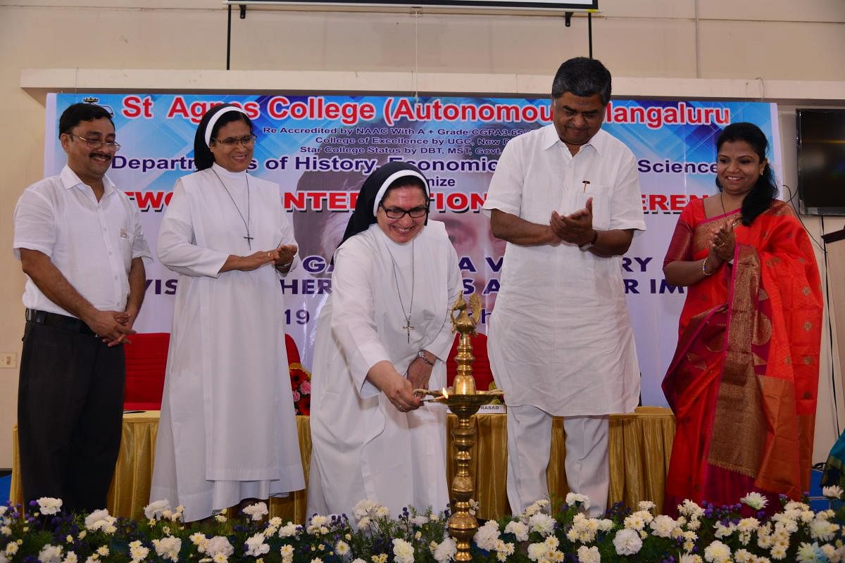 St Agnes College Principal Sr Dr Jeswina lights the lamp during the inaugural function of an international conference on ' Indira Gandhi - a visionary, revisiting her policies and their impact', at the College premises on Monday. Rajya Sabha member B K Hariprasad, St Agnes College Managing Committee Joint Secretary Sr Dr Maria Roopa, Political Science Department Head Chandramohan Marathe and History department Head Meera look on. DH Photo