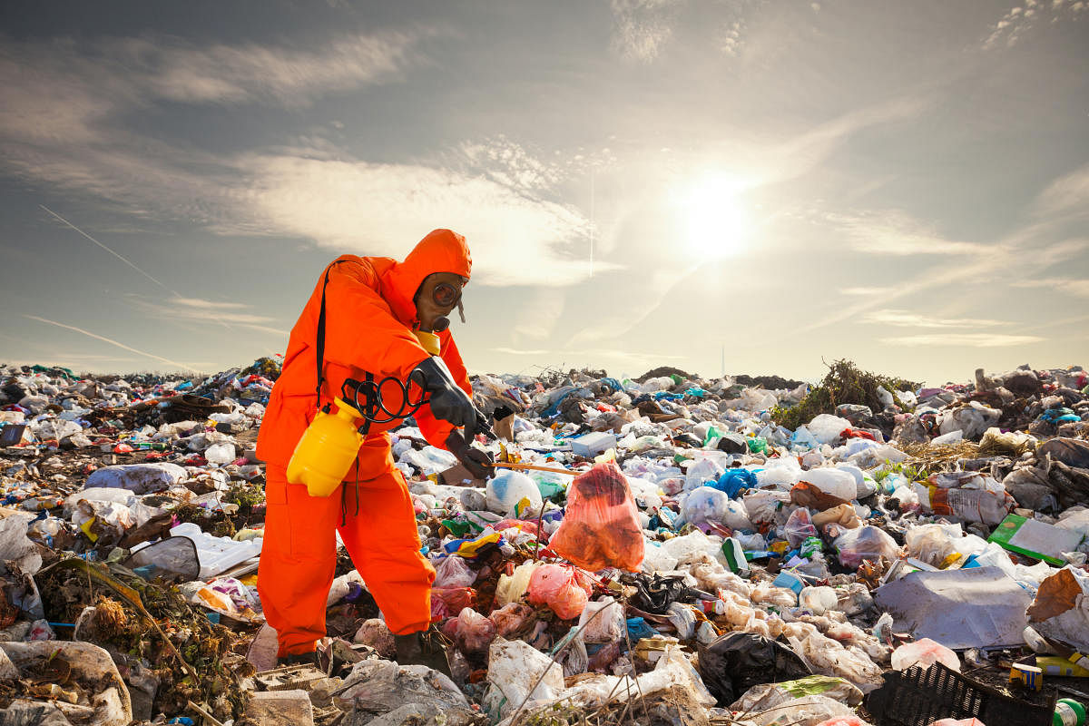 Sanitation worker working on the landfill