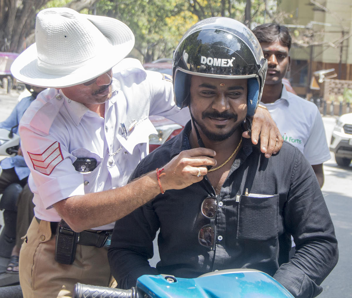 On the occasion of World Head Injury Day on 20th March, Fortis Hospitals in association with Bangalore Traffic Police distributed helmets to the people to raise awareness on the importance of using helmets while riding to ensure minimal damage in case of accidents. Photo by Prathiksha Mk