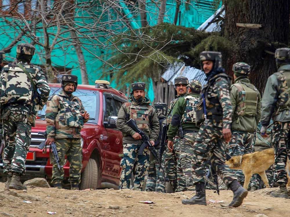 Army personnel cordon off the spot where militants were hiding during an encounter in which four militants and four security personnel including two policemen and two army jawans were killed, at Halmatpora in Kupwara district of North Kashmir on Wednesday. PTI Photo