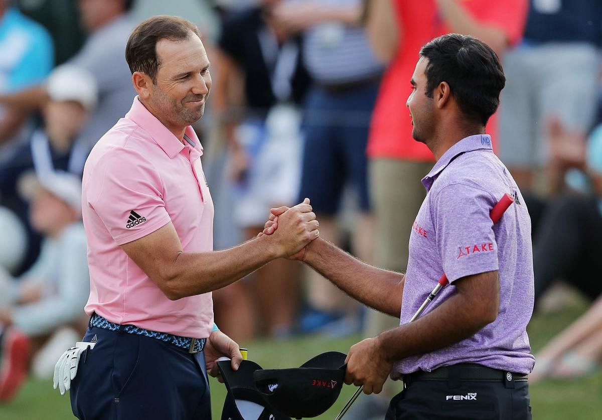 WELL-PLAYED! Sergio Garcia (left) shakes hands with Shubhankar Sharma after defeating him during the first round of the World Golf Championships in Austin, Texas, on Thursday. AFP