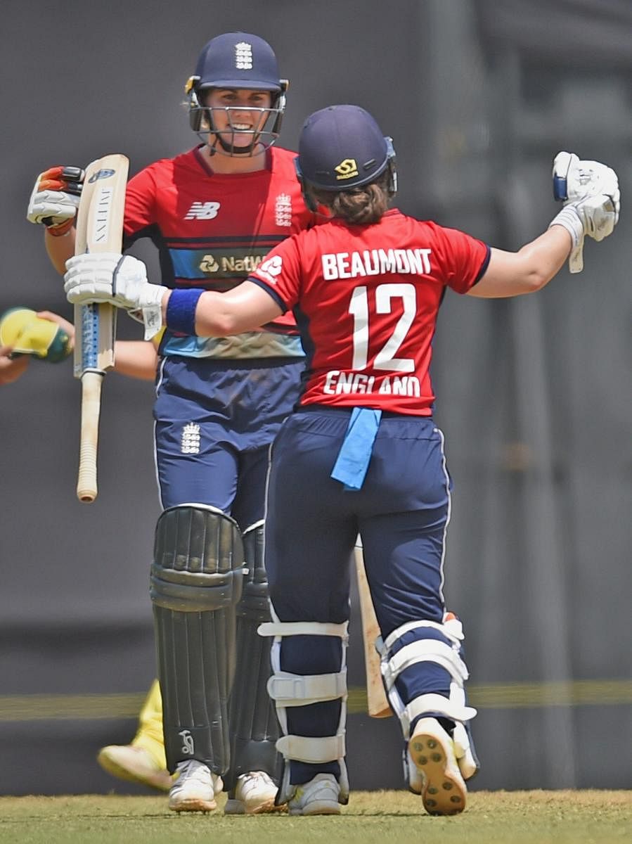 EASY-PEASY England's Natalie Sciver and Tammy Beaumont celebrate after their win over Australia in the women's T20 Tri-series in Mumbai on Friday. PTI