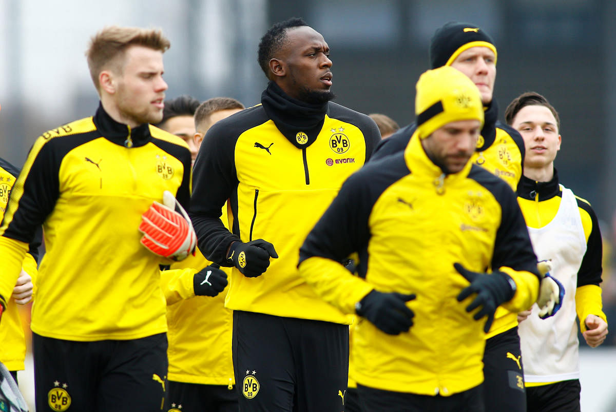 Usain Bolt participates in a training session with Borussia Dortmund players on Friday. Reuters