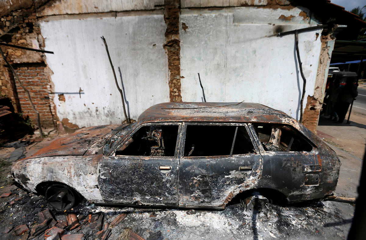 A burnt car is seen after a clash between two communities in Digana central district of Kandy, Sri Lanka March 8, 2018. REUTERS photo.