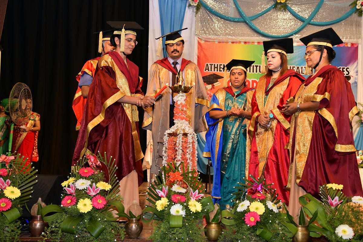 AIHS principal Prof Sr Dhanya Devasia inaugurates the convocation at the Athena Institute of Health Sciences at Town Hall in Mangaluru. AIHS chairperson R S Shettian and TNAI (Karnataka branch) secretary Prof P Girijamba Devi look on.