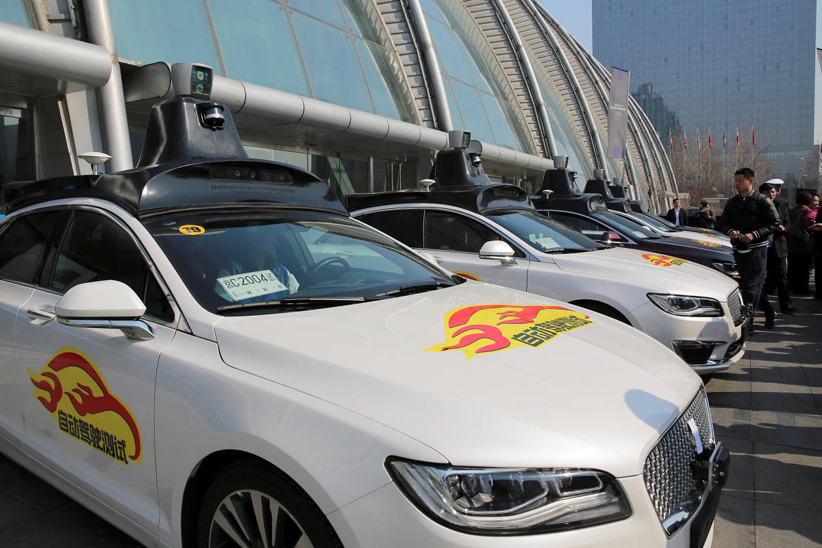 Baidu's Apollo autonomous cars are seen during a public road test for self-driving vehicles in Beijing, China March 22, 2018. REUTERS/Stringer ATTENTION EDITORS - THIS IMAGE WAS PROVIDED BY A THIRD PARTY. CHINA OUT.