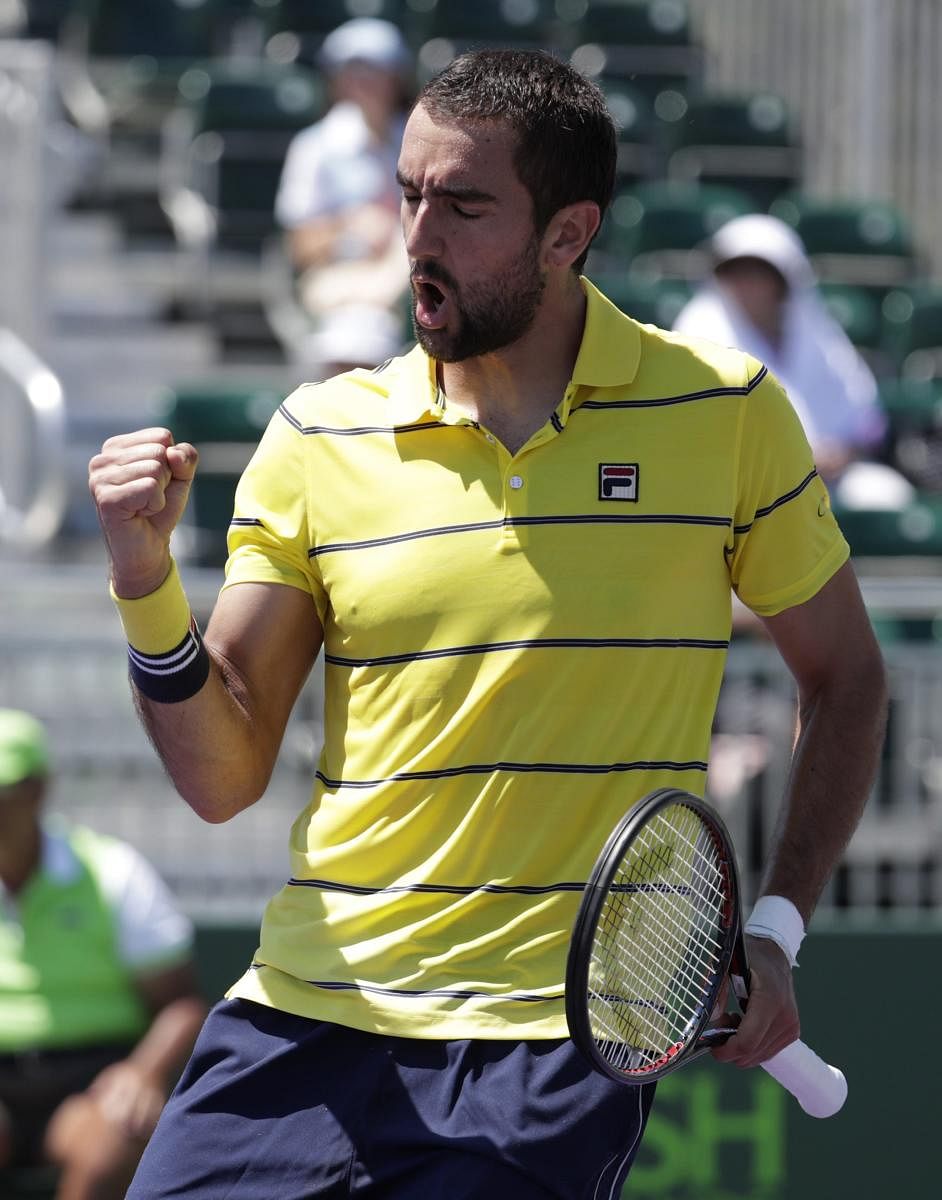 Jubilant: Croatia's Marin Cilic celebrates after winning a point against Vasek Pospisil of Canada at the Miami Masters on Sunday. AP/PTI