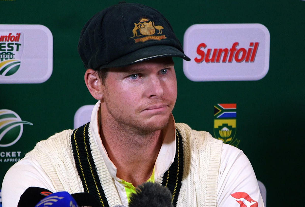 TOPSHOT - This video grab taken from a footage released by AFP TV shows Australia's captain Steve Smith speaking during a press conference in Cape Town, on March 24, 2018 as he admitted to ball-tampering during the third Test against South Africa. Australia captain Steve Smith and team-mate Cameron Bancroft sensationally admitted to ball-tampering during the third Test against South Africa on March 24, 2018, plunging cricket into potentially its greatest crisis. Bancroft was caught on television cameras appearing to rub a yellow object on the ball, and later said: "I was in the wrong place at the wrong time. I want to be here (in the press conference) because I want to be accountable for my actions." / AFP PHOTO / AFP TV / STR