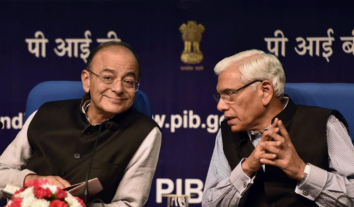 Union Finance Minister Arun Jaitley speaks with former Comptroller and Auditor-General (CAG) Vinod Rai, during Rai's book launch titled 'Seven Decades of Independent India-Ideas and Reflections', in New Delhi on Tuesday. PTI Photo