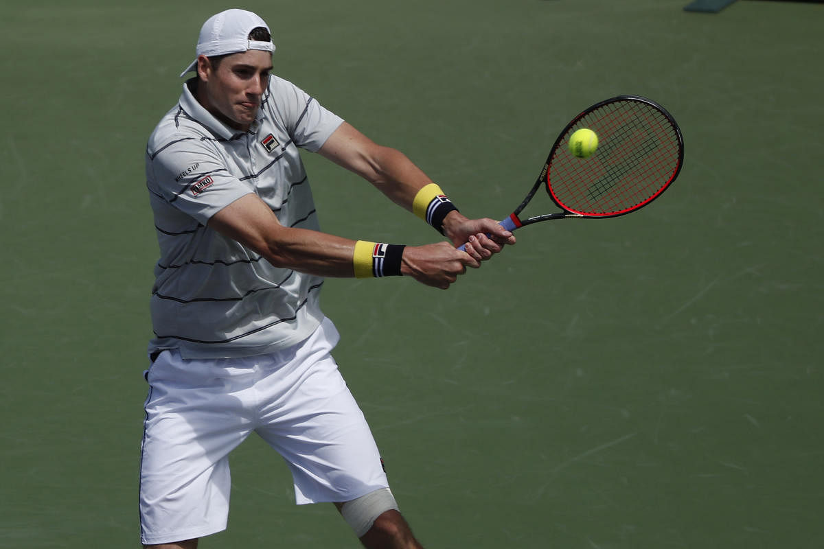 BIG WIN John Isner of the United States returns during his win over Marin Cilic of Croatia in the Miami Masters. USA TODAY