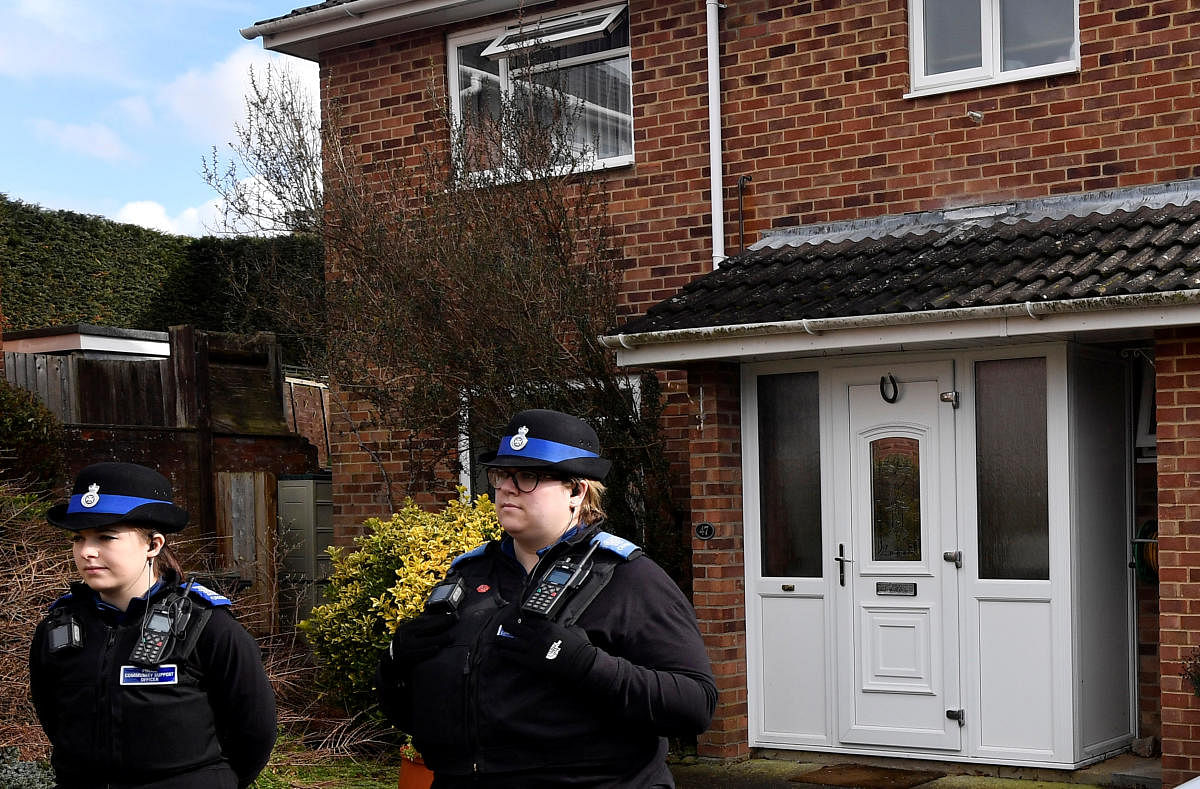Police officers stand guard outside of the home of former Russian military intelligence officer Sergei Skripal, in Salisbury, Britain. Reuters Photo
