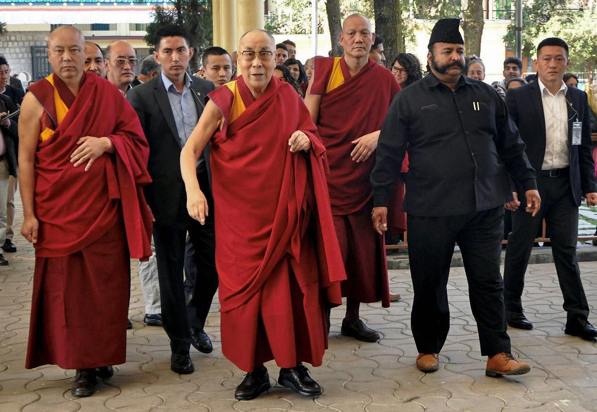 Dharamshala: Tibetan spiritual leader Dalai Lama arrives to attend the Mind and Life XXXIII conference at Tsuglagkhang complex in Dharamshala on Monday. PTI Photo(PTI3_12_2018_000045A)