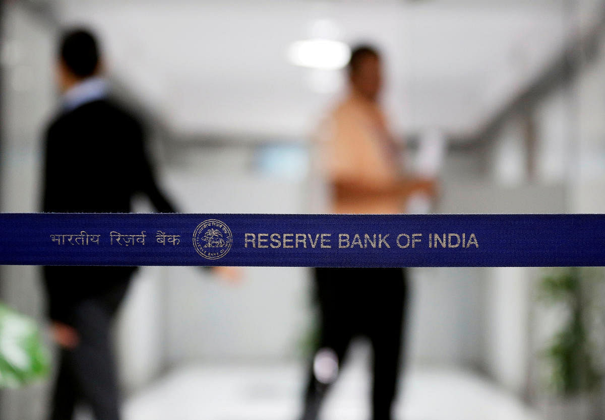 People walk past a barricade inside the Reserve Bank of India (RBI) headquarters in Mumbai. REUTERS