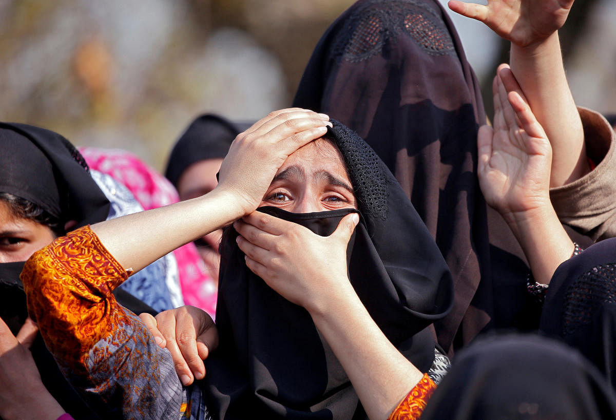 A woman wails during the funeral of a militant in Shopian district. REUTERS