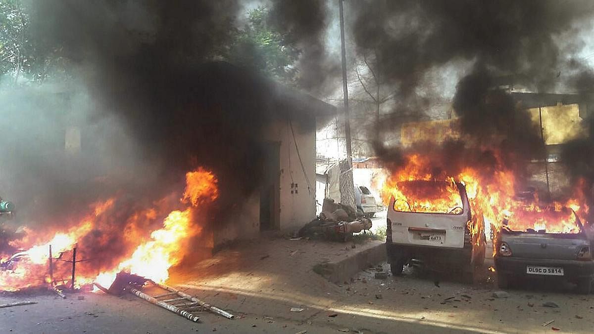 Vehicles set on fire by a group of protesters during 'Bharat Bandh' call given by Dalit organisations against the 'alleged' dilution of Scheduled Castes / Scheduled Tribes Act, in Meerut on Monday. PTI Photo