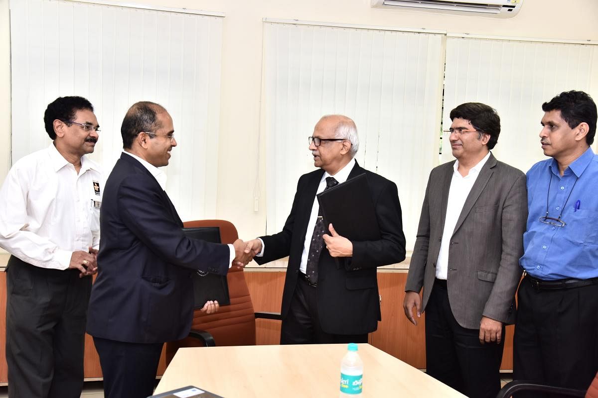 MAHE Vice Chancellor Dr H Vinod Bhat and Schrdinger Vice President Raghu Rangaswamy exchange an MoU for setting up a 'Center of Excellence in Molecular Simulation' at Manipal College of Pharmaceutical Sciences in Manipal.