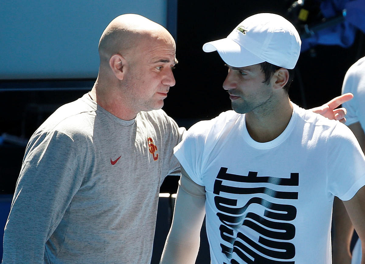 Novak Djokovic (right) and Andre Agassi