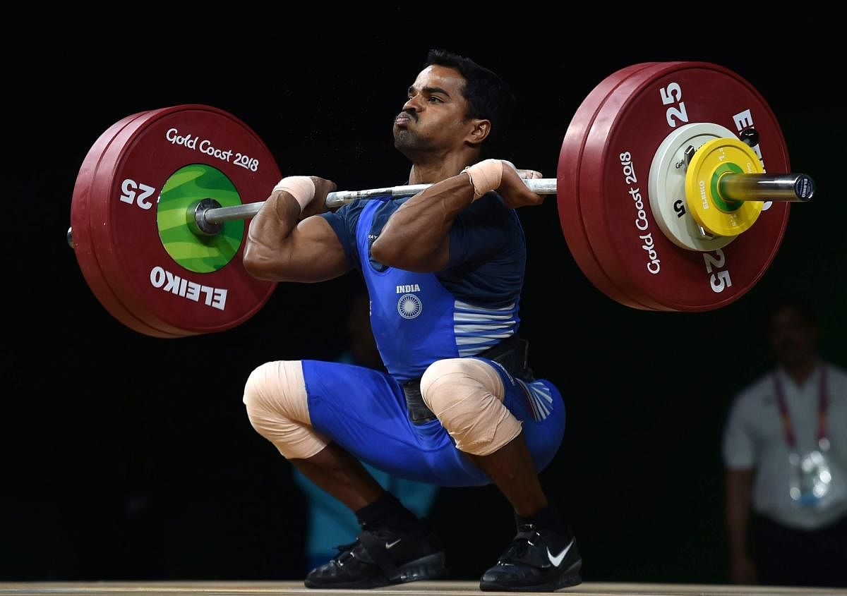 SILVER-LINING Gururaja Poojary en route to the silver medal in the 56 kg category on Thursday. PTI