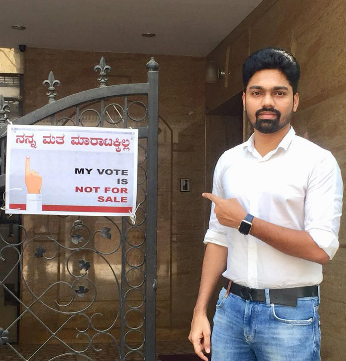 Anil Shetty shows the notice put up at the entrance of his house.