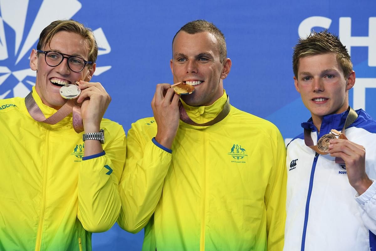 Australia's Kyle Chalmers (gold), compatriot Mack Horton (left) and Scotland's Duncan Scott (bronze) with their medals. AFP PHOTO