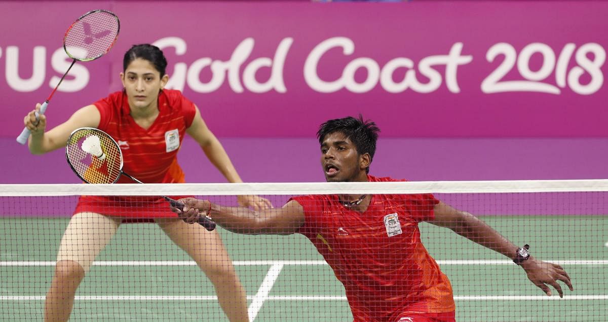 RED HOT India's Ashwini Ponnappa and Satwik Rankireddy during their mixed doubles team match against Singapore at the Commonwealth Games on Sunday. Ashwini-Satwik won 22-20, 21-18. REUTERS
