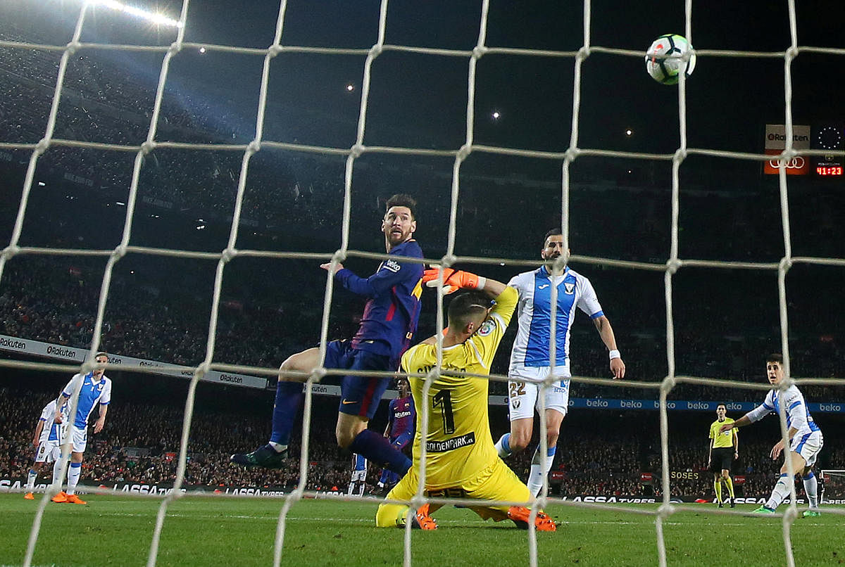 Barcelona's Lionel Messi scores his third goal against Leganes on Saturday. Reuters