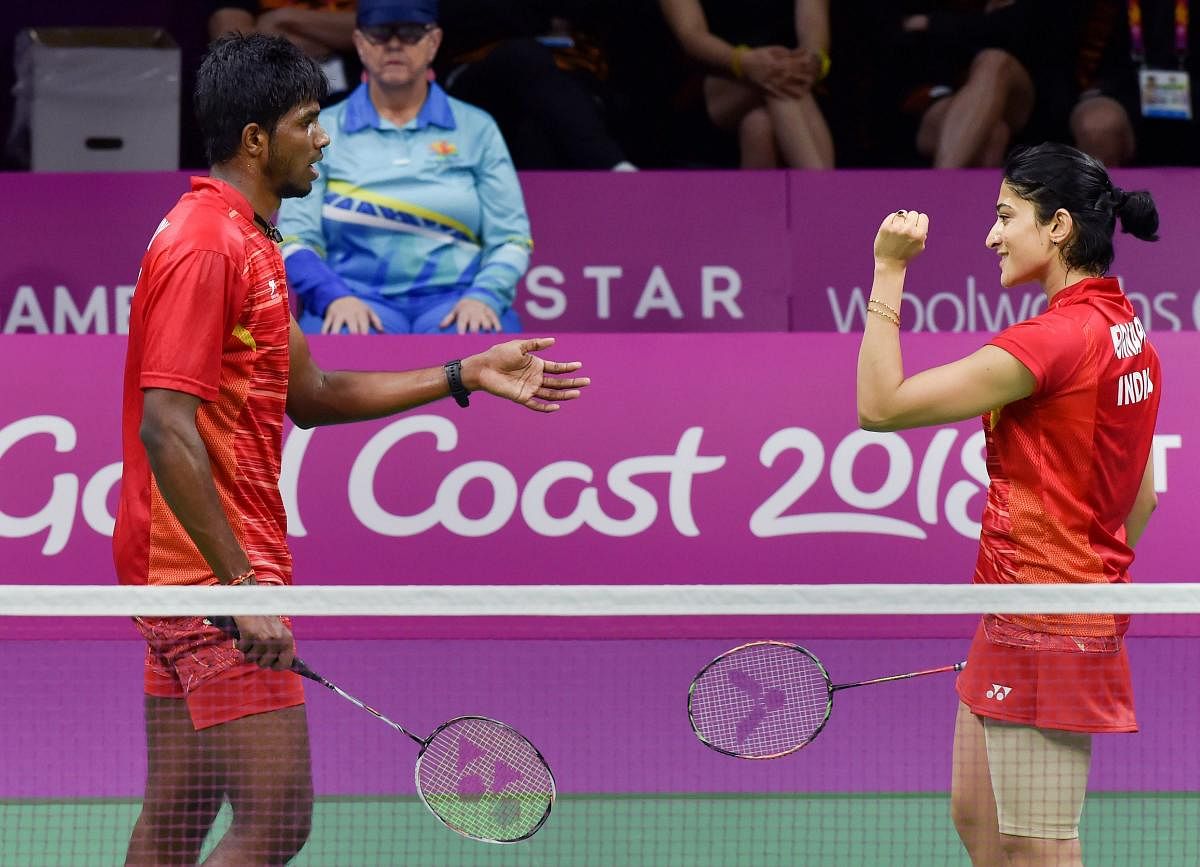India's Ashwini Ponnappa and Satwiksairaj Rankireddy celebrates after getting a point against Malaysia's Goh Liu Ying and Chan Peng Soon during the Mixed-team doubles badminton final at the Commonwealth Games 2018 in Gold Coast, on Monday. PTI Photo