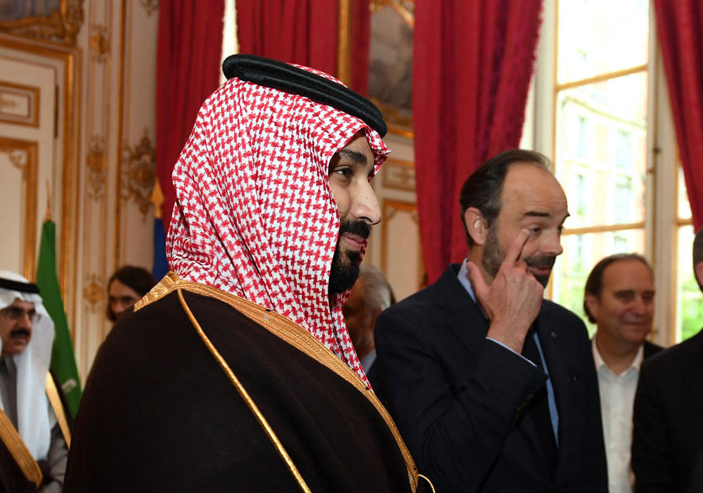 French Prime Minister Edouard Philippe escorts Saudi Arabia's Crown Prince Mohammed bin Salman upon his arrival at the Hotel de Matignon in Paris. Reuters file photo.