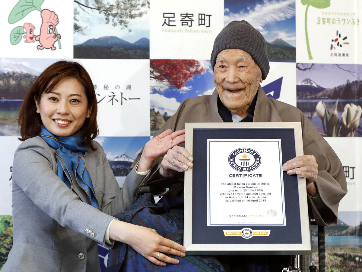 Japanese Masazo Nonaka, who was born 112 years and 259 days ago, receives a Guinness World Records certificate naming him the world's oldest man during a ceremony in Ashoro. Reuters Photo