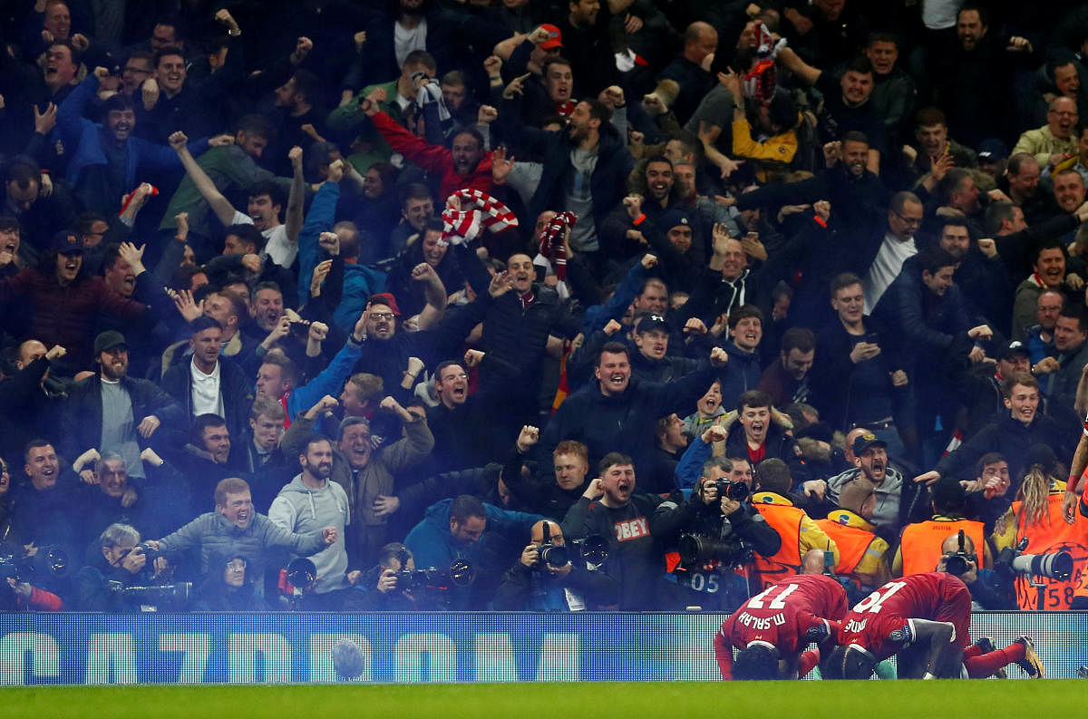 Liverpool's Mohamed Salah celebrates scoring their first goal with Sadio Mane.