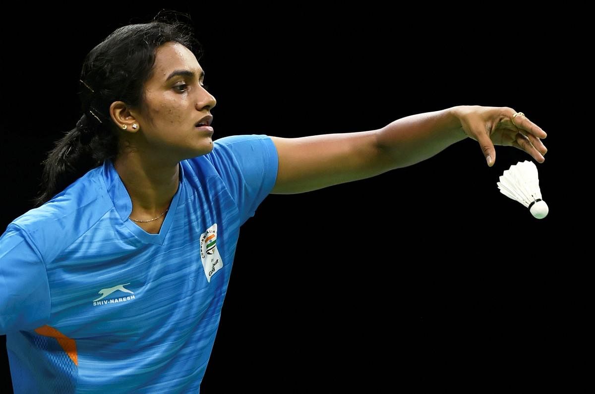 India's P V Sindhu serves to Fiji's Andra Whiteside during the badminton event of the Commonwealth Games on Wednesday. PTI