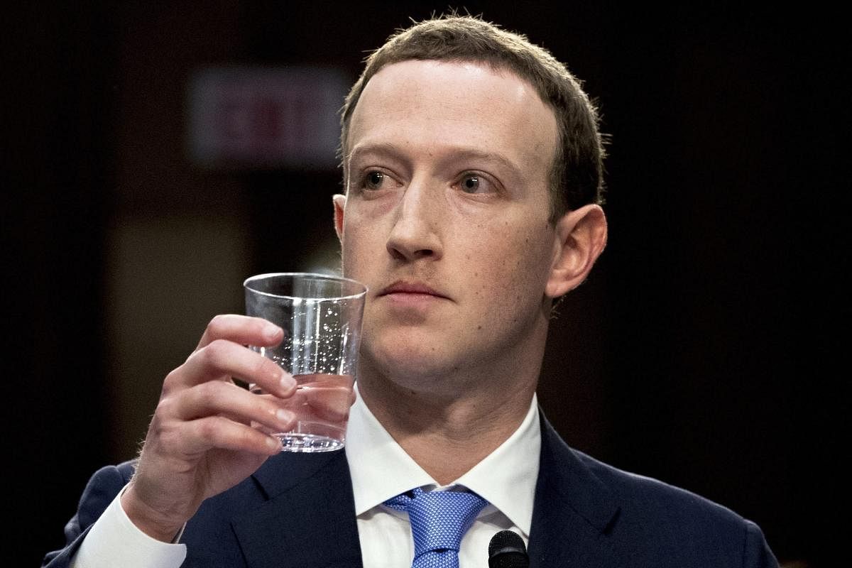 Facebook CEO Mark Zuckerberg takes a drink of water while testifying before a joint hearing of the Commerce and Judiciary Committees on Capitol Hill in Washington, Tuesday, April 10, 2018, about the use of Facebook data to target American voters in the 2016 election. AP/PTI.