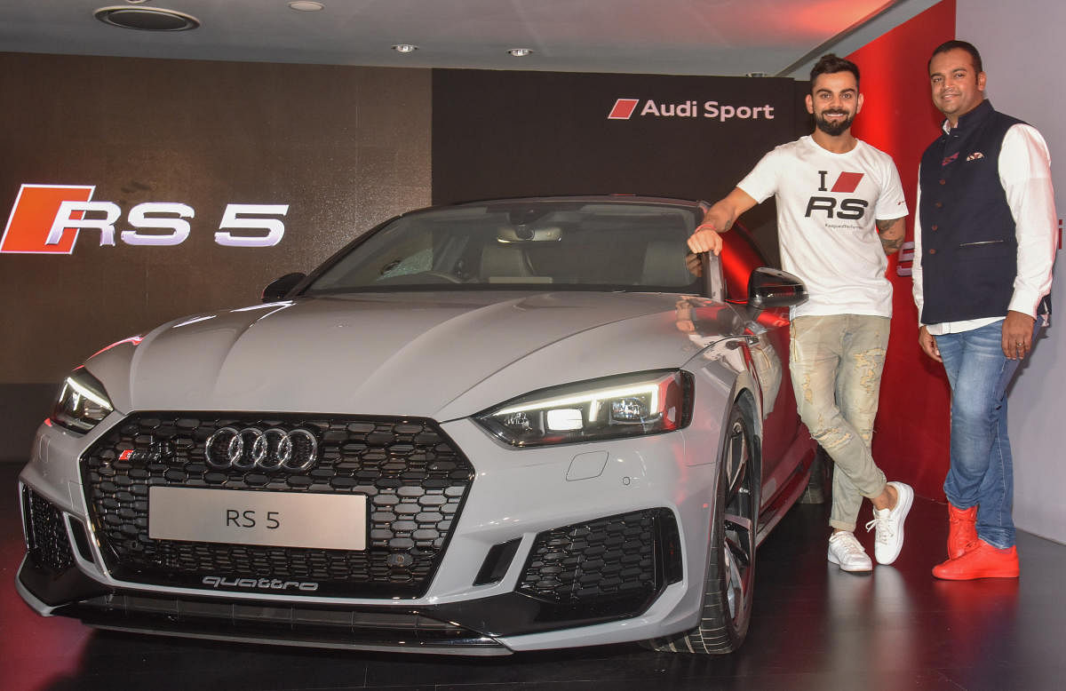 Virat Kohli, Indian cricket team captain and Rohit Ansari, Head Audi India are launch Audi Sport RS5 car at in Bengaluru on Wednesday. DH Photo by S K Dinesh