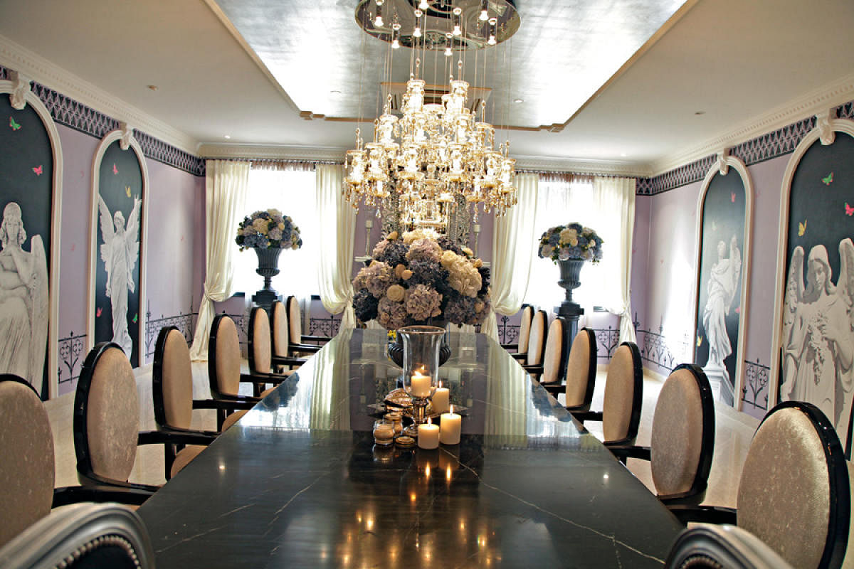 Double chandeliers add an extra touch of luxury to the living and dining areas.