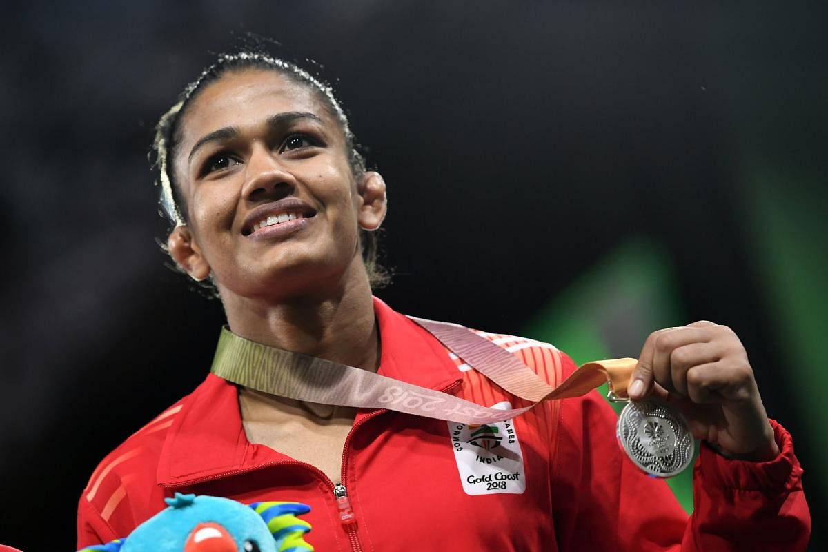ALL SMILES India's Babita Kumari, with the women's 53kg silver medal at the Commonwealth Games on Thursday. AFP