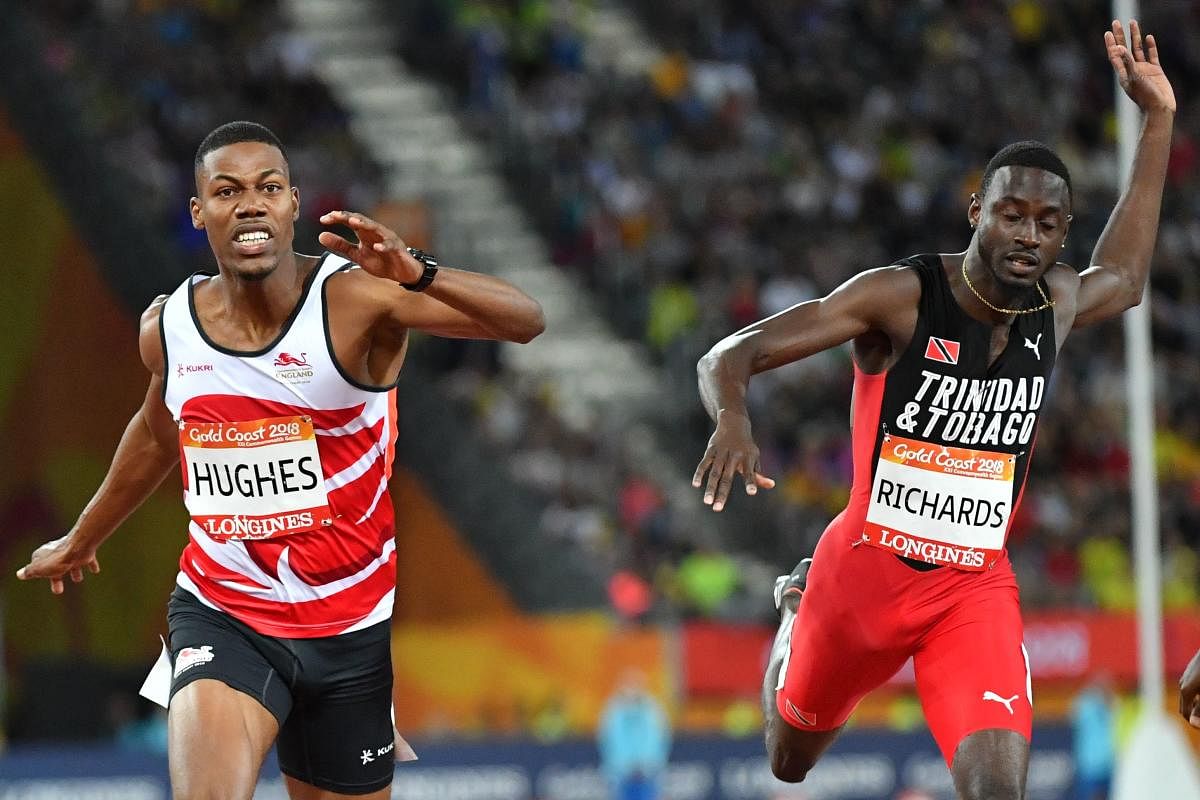 DRAMATIC END England's Zharnel Hughes (left) and Trinidad And Tobago's Jereem Richards crossed the finish line in the 200M with same time but the former was disqualified for hitting the latter over the last few metres. AFP