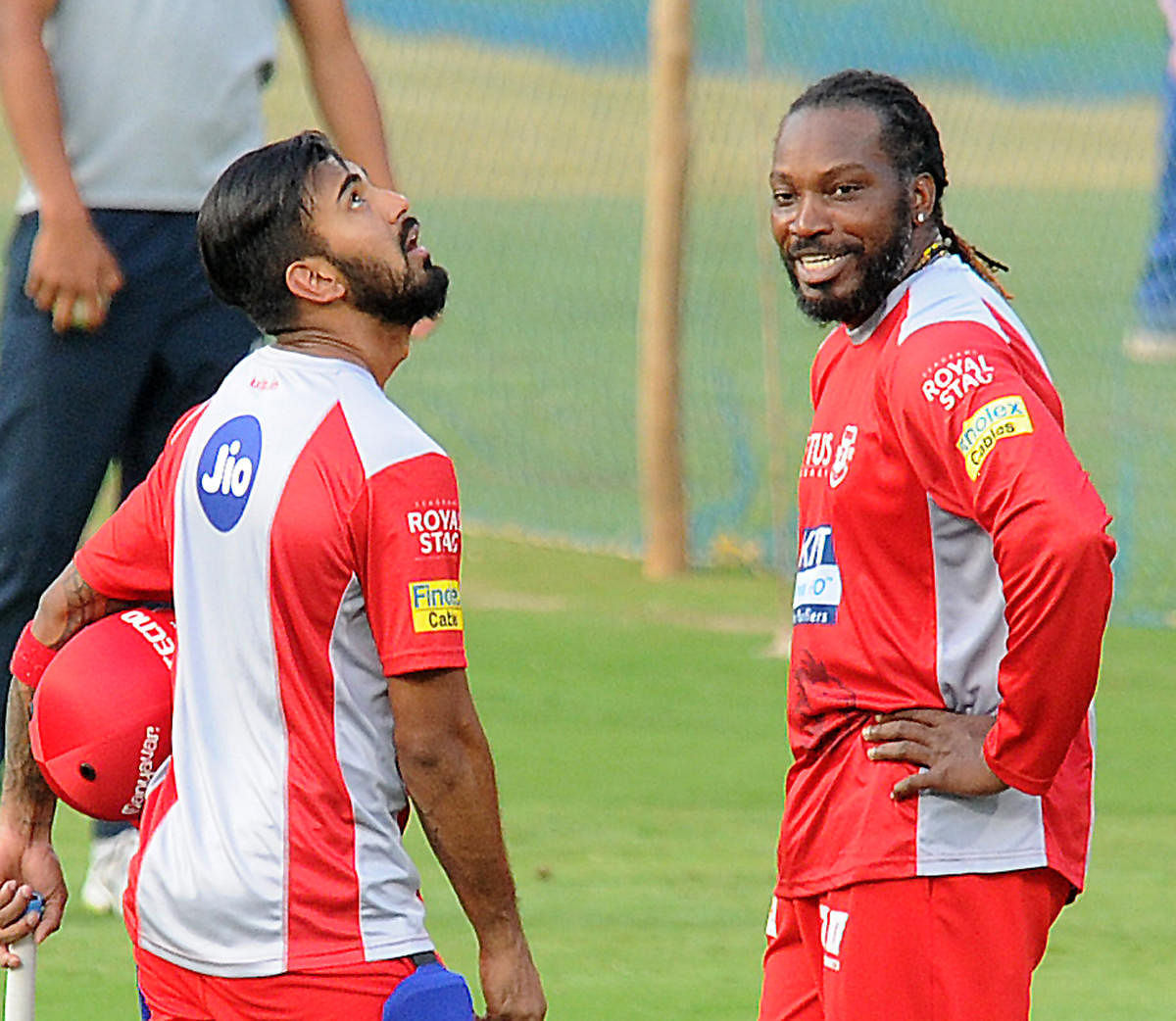 HOMECOMING! Kings XI Punjab's Chris Gayle has a chat with K L Rahul during a practice session on Thursday. DH PHOTO/ SRIKANTA SHARMA R