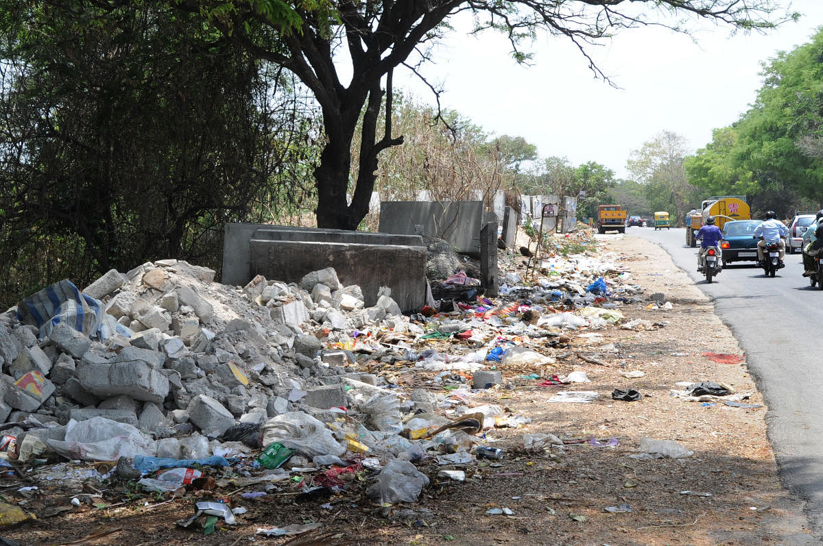 Garbage and debris dumped next to the compound of Roerich Estate on kanakapura road. Many of the Russian tourists who visits to the estate complained to cleared it. Photo Srikanta Sharma R.