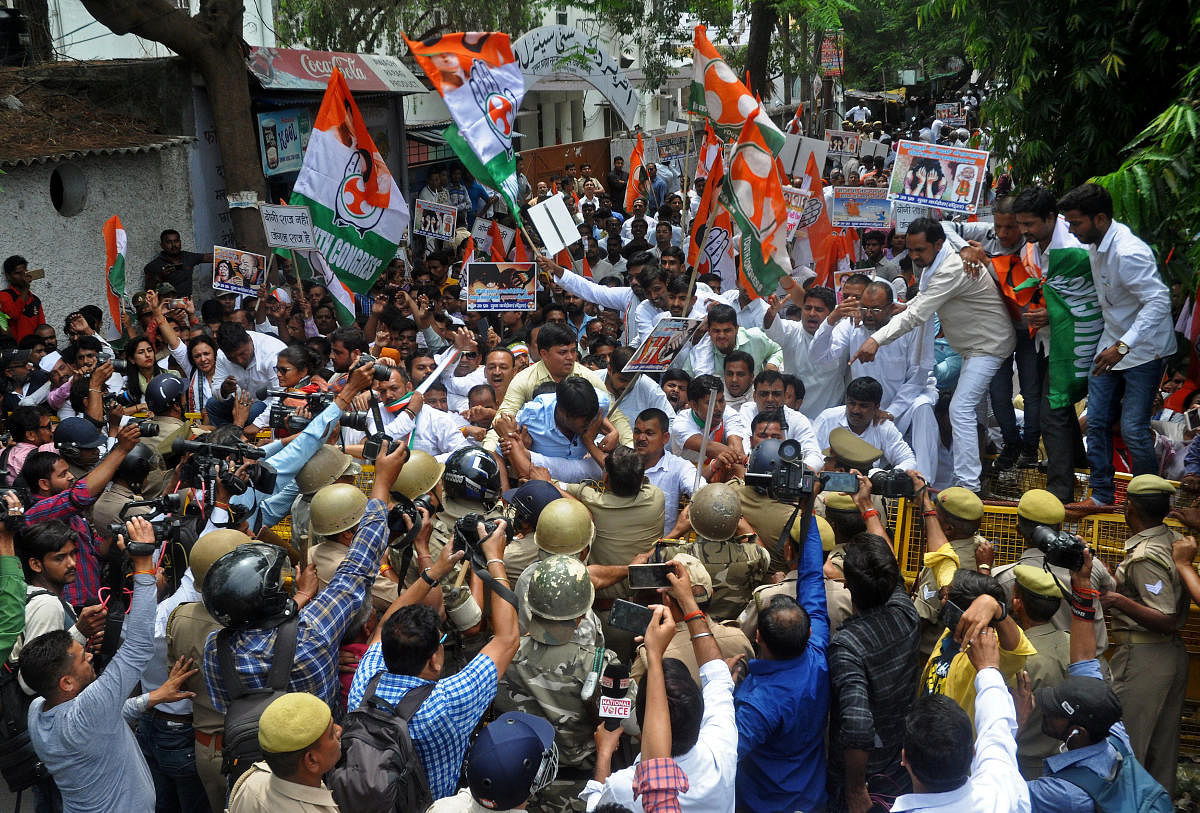 Supporters of India's main opposition Congress Party scuffle with police during a protest demanding the arrest of Kuldeep Singh Sengar, a state legislator from India's ruling Bharatiya Janata Party (BJP), in Lucknow, India April 12, 2018.