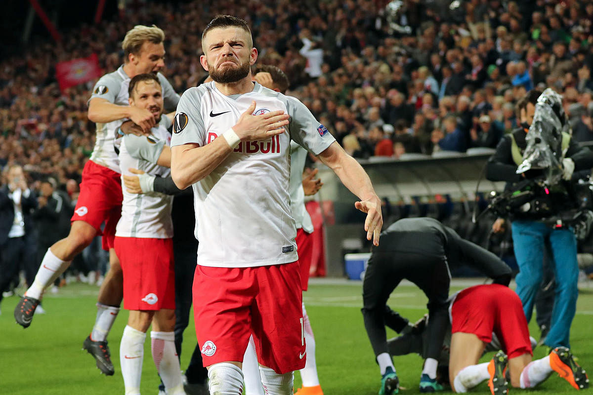 Red Bull Salzburg-players celebrate their team's victory over Lazio in the quarterfinal on Friday. AFP