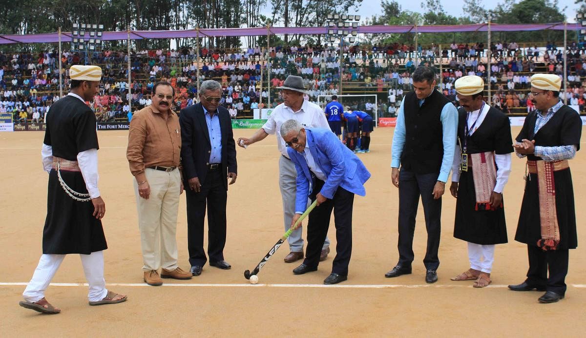 Former Indian hockey captain Mollera P Ganesh inaugurates 22nd edition of Kodava Families' Hockey Tournament at General Thimmaiah Stadium at Napoklu on Sunday.
